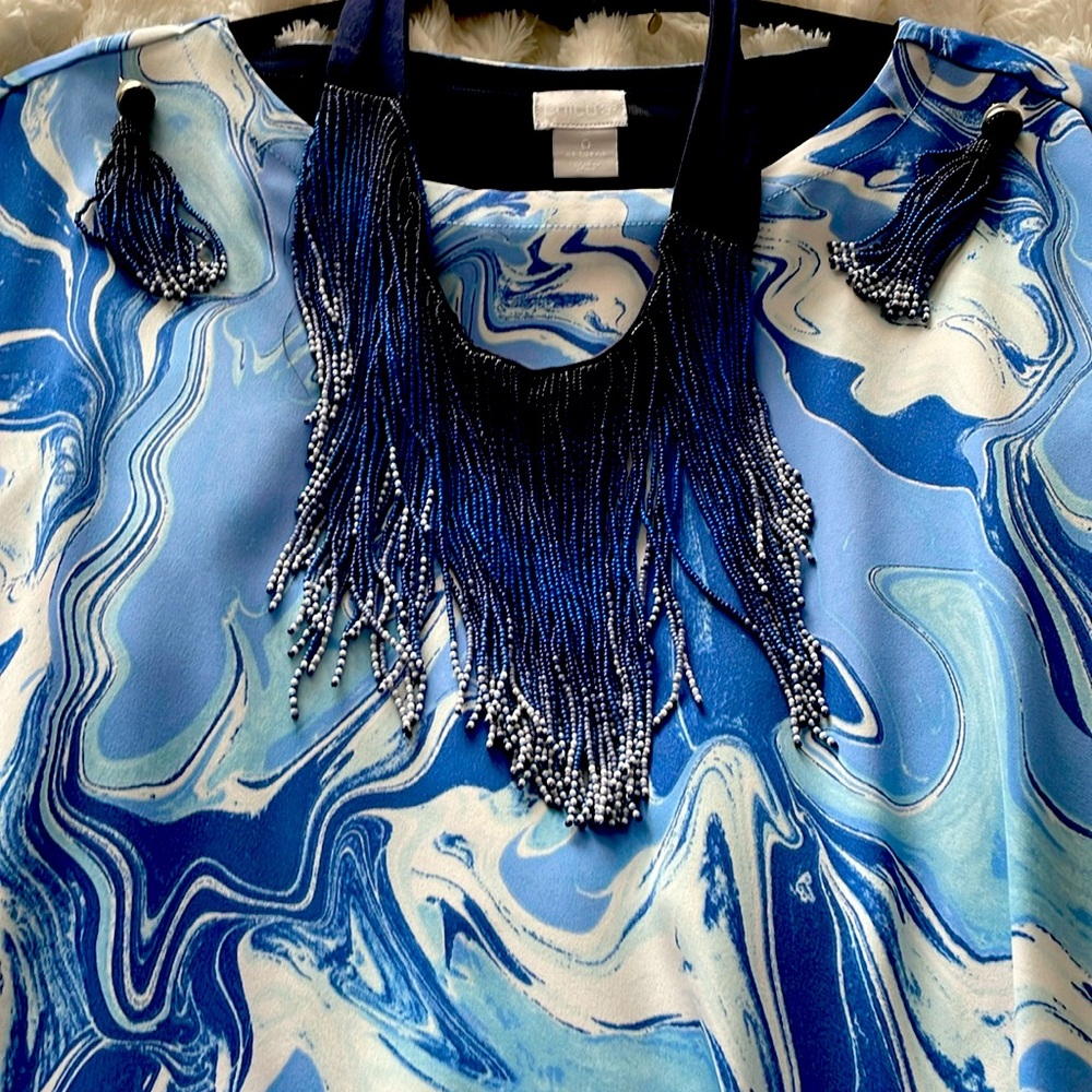 I’m selling the perfect dress for these earrings and mating necklace.